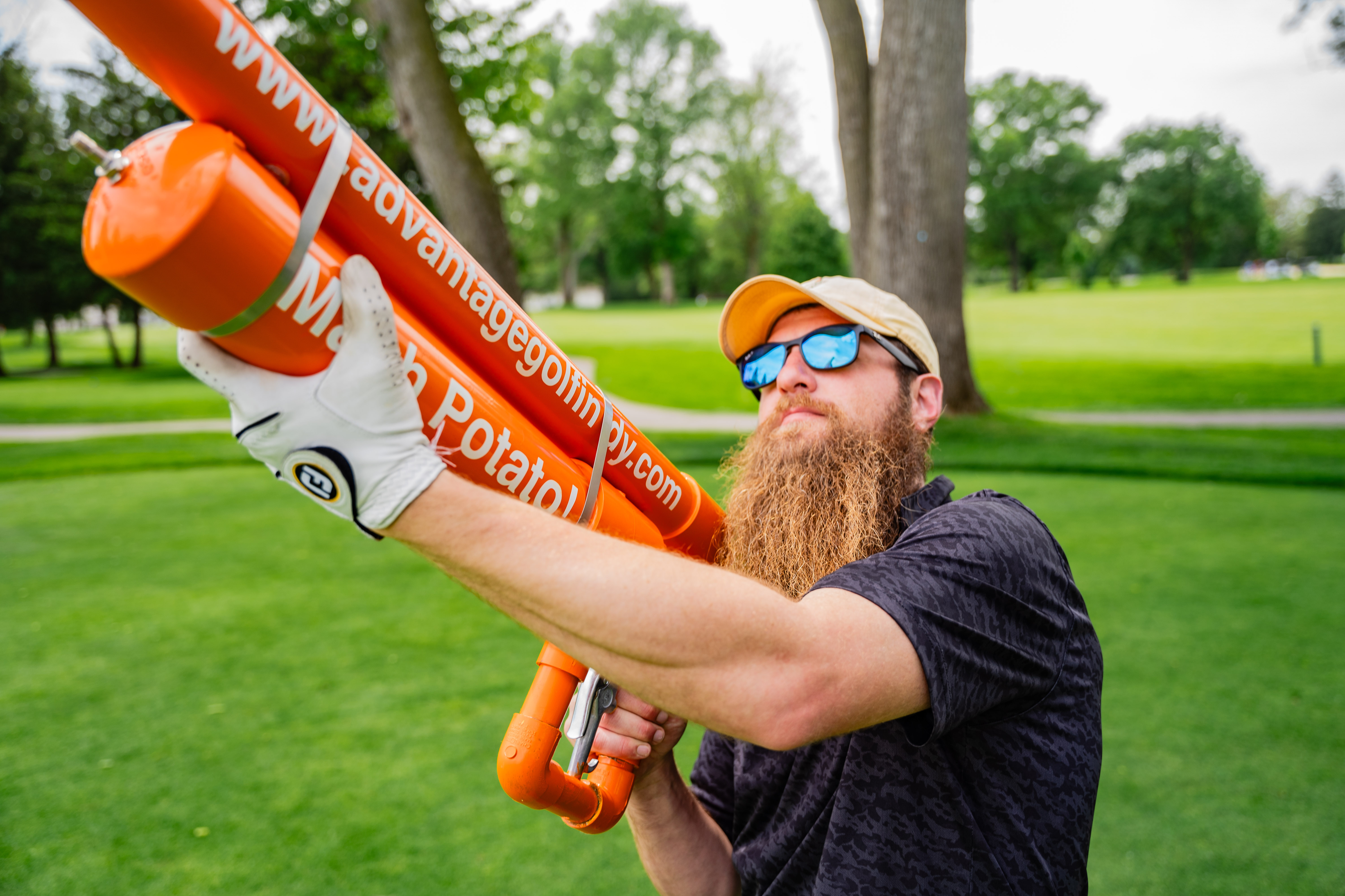 man shooting a golf cannon