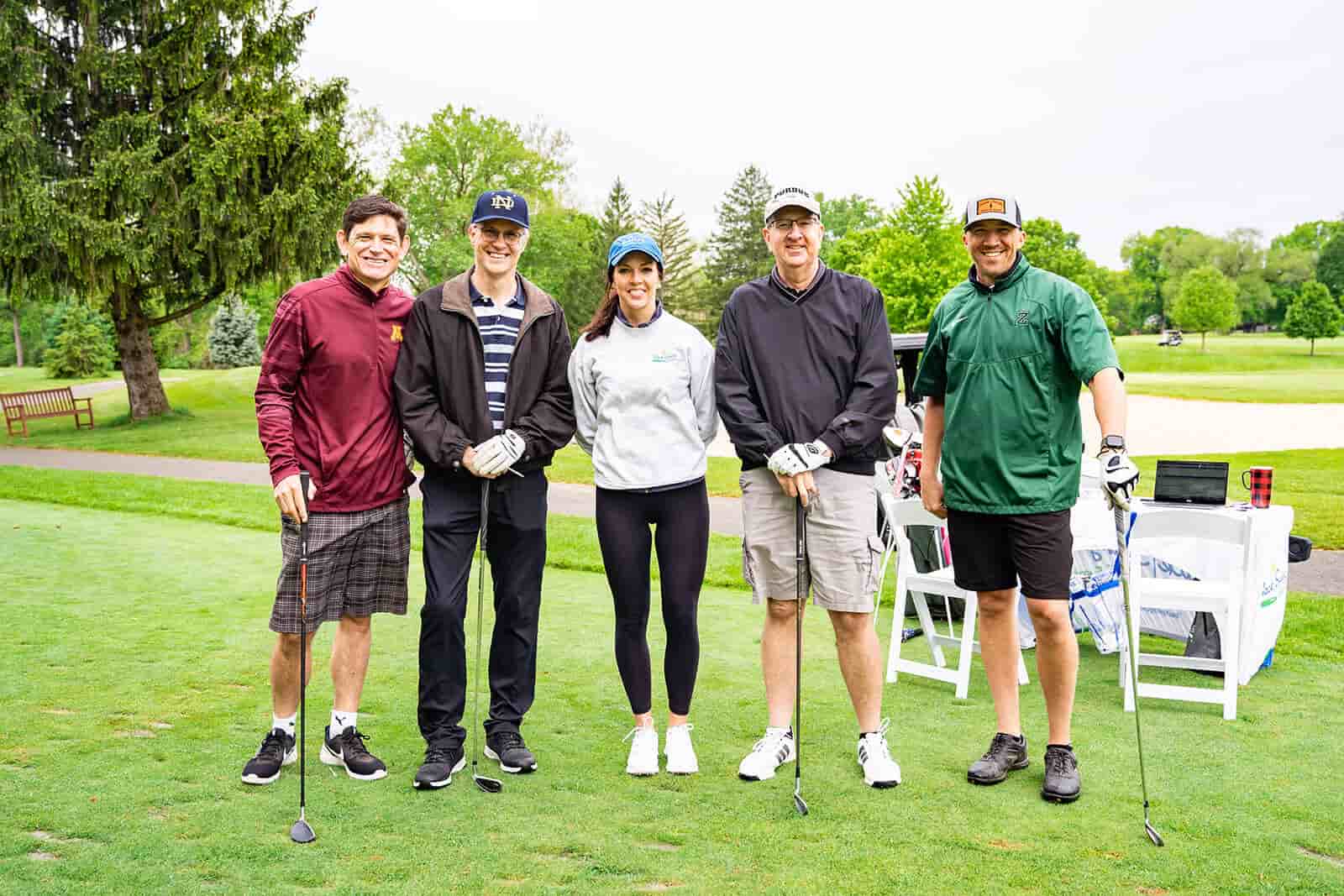 Players in a golf cart