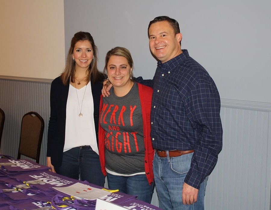 expo volunteers pose