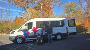 rodriguez-family-in-front-of-van-with-balloons